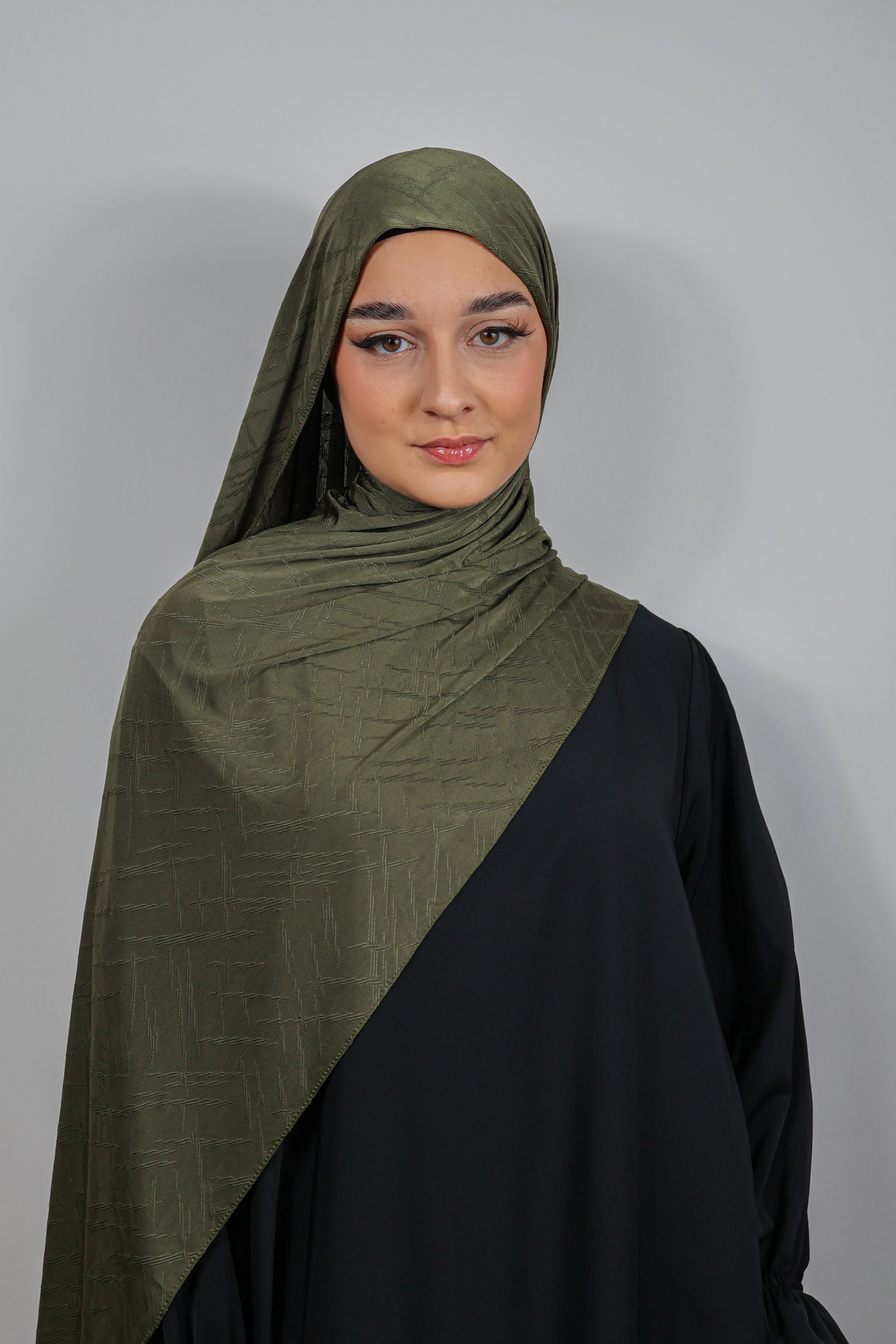 Gros plan sur les textures subtiles du Jersey Prestige marron rosé, chic et sophistiqué.