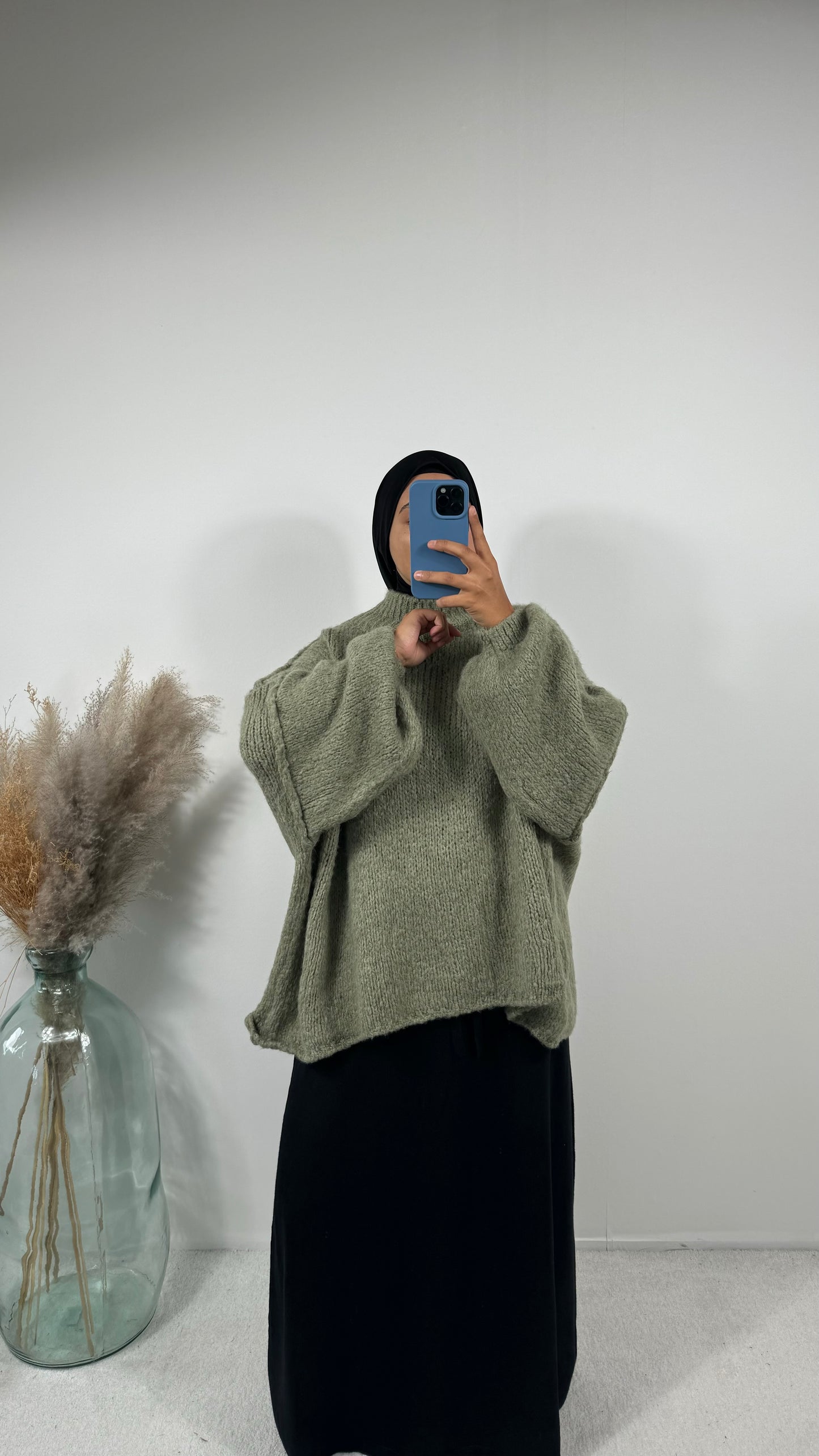 Pull en laine vert sapin, tendance pour la saison automnale.